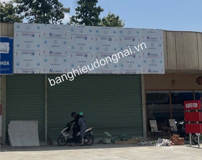 Storefront with signage and motorcycle